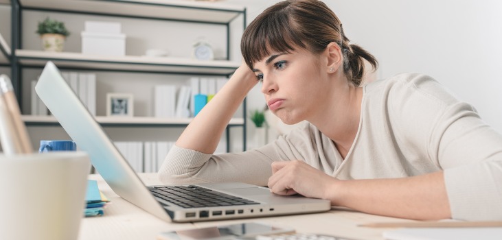 disappointed woman working on her pc